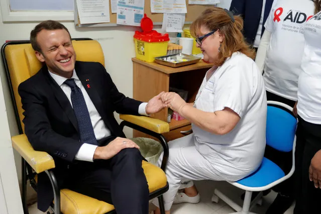 A nurse takes blood for a HIV test for French President Emmanuel Macron as he visits the Delafontaine Hospital in Saint-Denis, Freance as part of the World AIDS Day, December 1, 2017. (Photo by Charles Platiau/Reuters)