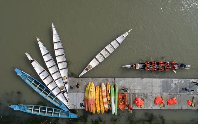 Contestants train in dragon boats on the Li canal. Huai'an City, Jiangsu Province, China, June 14, 2020. Huai'an will hold the first Grand Canal Dragon Boat open competition during the Dragon Boat Festival.(Photo by Costfoto/Barcroft Media via Getty Images)