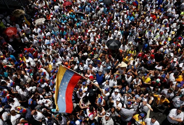 Opposition supporters take part in a rally to demand a referendum to remove Venezuela's President Nicolas Maduro in Caracas, Venezuela, September 1, 2016. (Photo by Carlos Garcia Rawlins/Reuters)