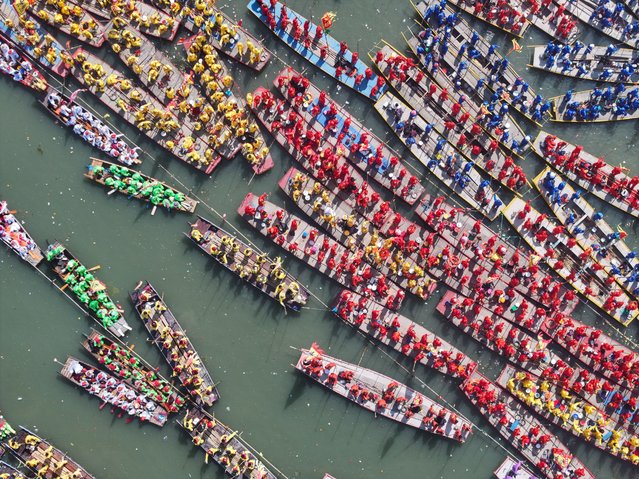 An aerial drone photo taken on April 6, 2025 shows people gathering for the 2025 Qintong Boat Festival held at Qinhu National Wetland Park in Jiangyan District of Taizhou, east China's Jiangsu Province. Over five hundred boats with more than 10,000 boat team members aboard gathered here on Sunday for the Qintong Boat Festival, which has been a centuries-old tradition. The Qintong Boat Festival was listed as the state-level intangible cultural heritage in 2008. (Photo by Xinhua News Agency/Rex Features/Shutterstock)