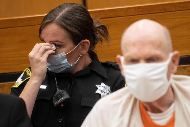A Sacramento County Sheriff’s deputy wipes her eye as she listens in to the third day of victim impact statements while guarding Joseph James DeAngelo, known as the Golden State Killer, at the Gordon D. Schaber Sacramento County Courthouse in Sacramento, California, U.S. August 20, 2020. (Photo by Santiago Mejia/Pool via Reuters)