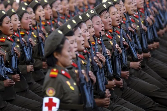 Soldiers shout slogans under the stands with North Korean leader Kim Jong Un and other officials during the parade celebrating the 70th anniversary of the founding of the ruling Workers' Party of Korea, in Pyongyang October 10, 2015. (Photo by Damir Sagolj/Reuters)