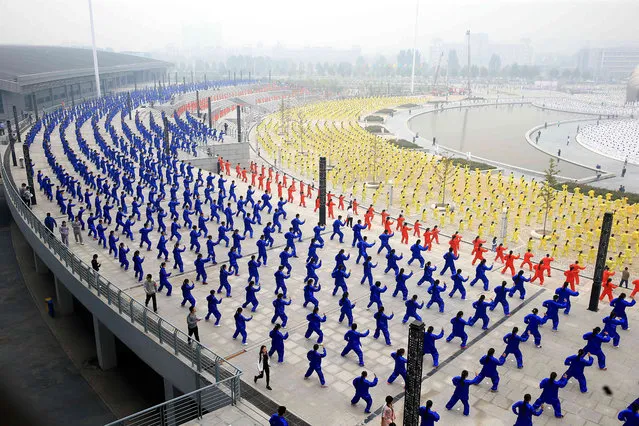 Participants perform Tai Chi at a square in Jiefang District during a world wide Tai Chi activity on October 18, 2015 in Jiaozuo, Henan Province of China. A world wide Tai Chi activity called up by Jiaozuo City planted to gather about one million people in over fifty world wide cities to perform Tai Chi on Sunday for the Guinness World Records. (Photo by ChinaFotoPress/ChinaFotoPress via Getty Images)