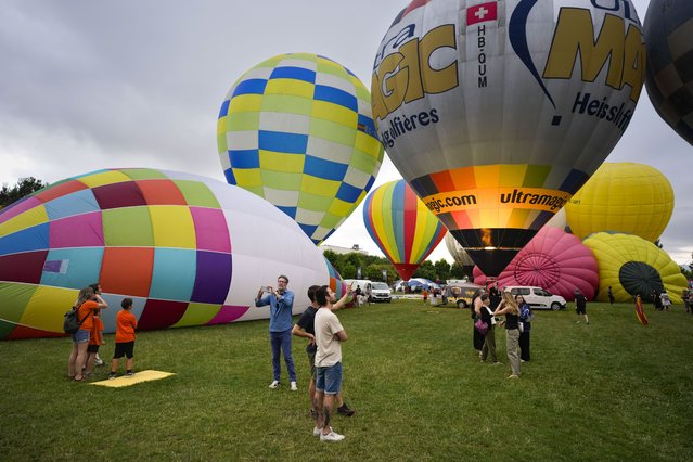 Preparations underway for the opening event of the 29th European Balloon Festival in the town of Igualada, Barcelona, northeastern Spain, 10 July 2025. Some 50 balloons are attending the festival, the biggest event of southern Europe. (Photo by Enric Fontcuberta/EPA)