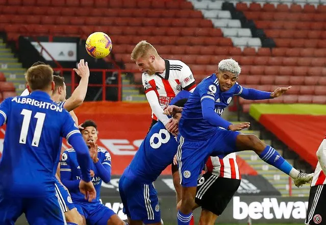 Oliver McBurnie of Sheffield United battles for possession with Wesley Fofana of Leicester City during the Premier League match between Sheffield United and Leicester City at Bramall Lane on December 06, 2020 in Sheffield, England. The match will be played without fans, behind closed doors as a Covid-19 precaution. (Photo by AP Photo/Stringer)