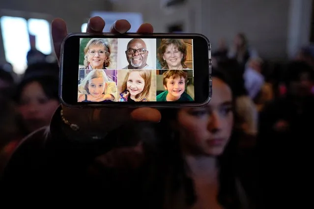 A demonstrator displays a picture of the victims of the Covenant School shooting on their phone inside the Tennessee State Capitol after a deadly shooting at the Covenant School in Nashville, Tennessee on March 30, 2023. Protesters flooded Tennessee's statehouse on Thursday to demand lawmakers stiffen gun laws following a school shooting in Nashville that left six people dead, three of them 9-year-old children. (Photo by Cheney Orr/Reuters)