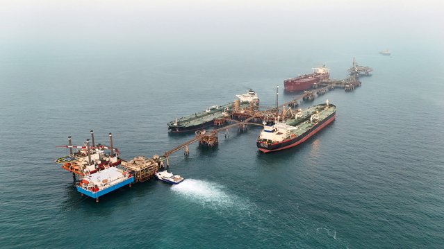 A drone view shows oil tankers loading crude oil at the Basra Oil Terminal in Iraqi territorial waters, off the coast of Basra, Iraq, on August 5, 2025. (Photo by Mohammed Aty/Reuters)