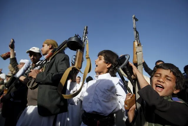 Boys hold up rifles as they participate in a demonstration against Saudi-led strikes in Yemen's capital Sanaa November 20, 2015. (Photo by Khaled Abdullah/Reuters)