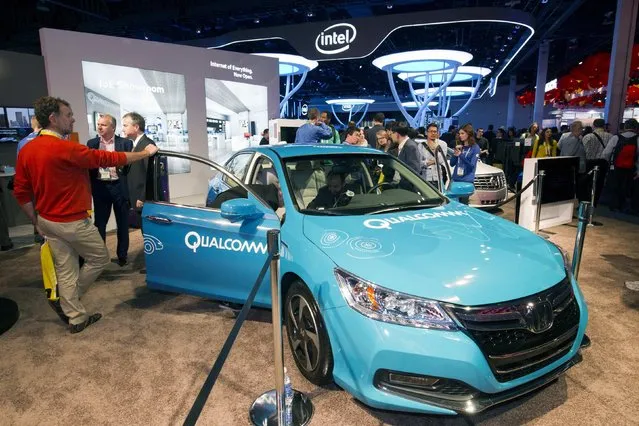 An electric car is shown at the Qualcomm booth during the 2015 International Consumer Electronics Show (CES) in Las Vegas, Nevada January 6, 2015. Qualcomm was demonstrating technologies such as wireless charging and vehicle-to-vehicle communication. (Photo by Steve Marcus/Reuters)