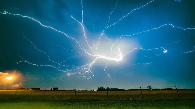 Lightning in the sky over Poznan, Poland 29 June 2017. Reports state that after storms on 28 June 2017 firefighters had deal with more than 750 emergency incidents. The Polish Meteorology Hydrology and Water Management has given a first degree alert of storms and wind. (Photo by Lukasz Ogrodowczyk/EPA)