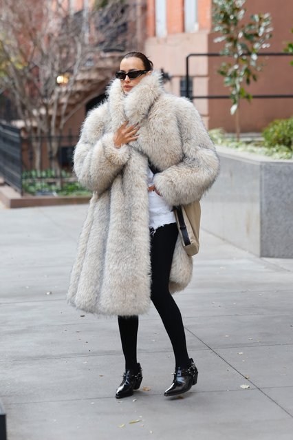 Russian fashion model Irina Shayk was spotted out and about in New York City on December 8, 2025 wearing a stylish fur coat paired with denim shorts, black tights, and Junya Watanabe spiky varnish shoes, showcasing her bold fashion sense on the streets. (Photo by Backgrid USA)