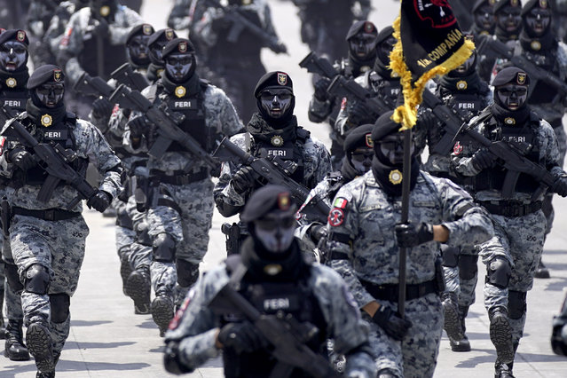 Mexican National Guards march in the Independence Day military parade through the capital's main square, the Zocalo, in Mexico City, Monday, September 16, 2024. (Photo by Felix Marquez/AP Photo)