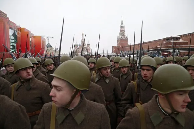People in historical uniforms take part in the military parade on the Red Square in Moscow, Russia, 07 November 2016. The parade marks the anniversary of a historical parade in 1941 when Soviet soldiers marched through the Red Square to the front lines of World War II. (Photo by Maxim Shipenkov/EPA)