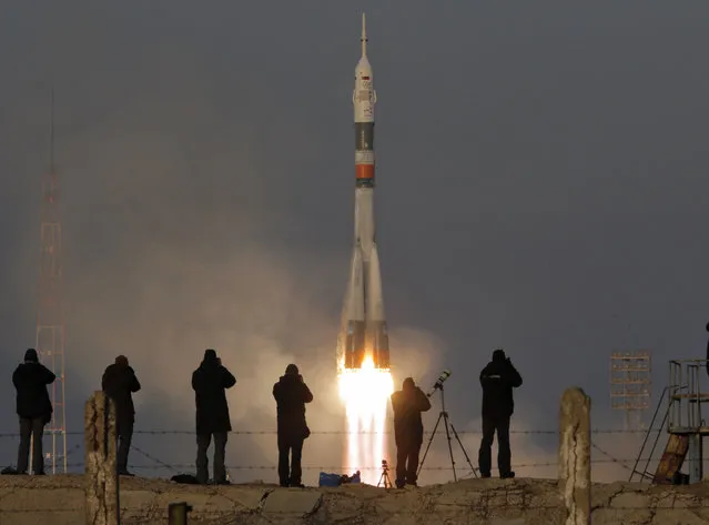 The Soyuz-FG rocket booster with Soyuz TMA-19M space ship carrying a new crew to the International Space Station, ISS, blasts off at the Russian leased Baikonur cosmodrome, Kazakhstan, Tuesday, December 15, 2015. The Russian rocket carries British astronaut Tim Peake, Russian cosmonaut Yuri Malenchenko and U.S. astronaut Tim Kopra. (Photo by Dmitry Lovetsk/AP Photoy)
