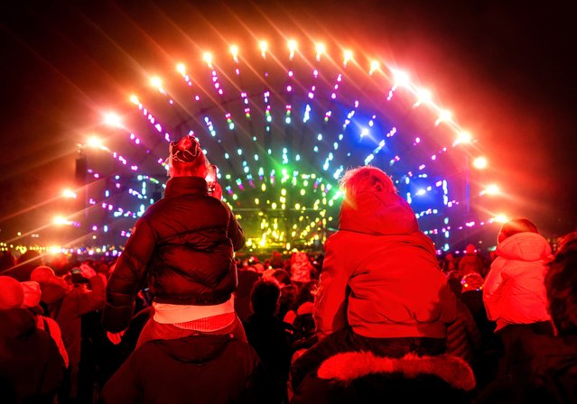 Participants enjoy a fireworks display for children as part of New Year's Eve celebrations at the Museumplein square in Amsterdam, the Netherlands, 31 December 2024. (Photo by Koen van Weel/EPA/EFE)