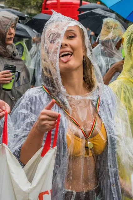 The rain comes but fails to dampen spirits too much during the Notting Hill Carnival in London, Britain on August 26, 2018. (Photo by Guy Bell/Rex Features/Shutterstock)