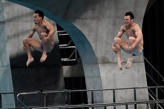 Mexico's Yahel Castillo Huerta and Juan Manuel Celaya Hernandez perform a dive in the men's synchronized 3-meter springboard final at the FINA Diving World Cup Sunday, May 2, 2021, at the Tokyo Aquatics Centre in Tokyo. (Photo by Eugene Hoshiko/AP Photo)