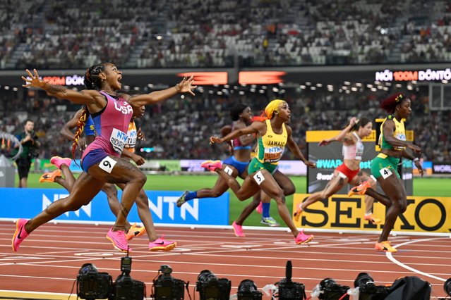 Sha'Carri Richardson, of the United States, spreads her arms as he crosses the line to win the women's 100 meter final during the World Athletics Championships in Budapest, Hungary, Monday, August 21, 2023. (Photo by Denes Erdos/AP Photo)