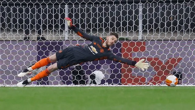 Manchester United's Spanish goalkeeper David de Gea fails to save a penalty shot during the UEFA Europa League final football match between Villarreal CF and Manchester United at the Gdansk Stadium in Gdansk on May 26, 2021. (Photo by Kacper Pempel/Reuters)