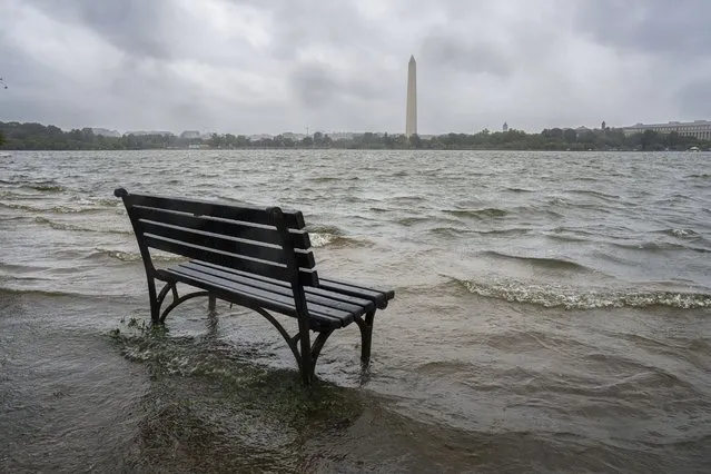 The Tidal Basin in Washington overflows the banks with the rain from Tropical Storm Ophelia, Saturday, September 23, 2023. The National Weather Service has issued a coastal flooding warning for the area. (Photo by J. David Ake/AP Photo)