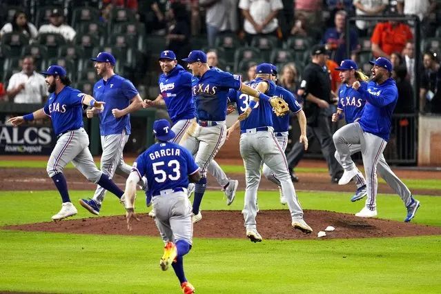 The Texas Rangers celebrate after Game 7 of the baseball AL Championship Series against the Houston Astros Monday, October 23, 2023, in Houston. The Rangers won 11-4 to win the series 4-3. (Photo by Tony Gutierrez/AP Photo)