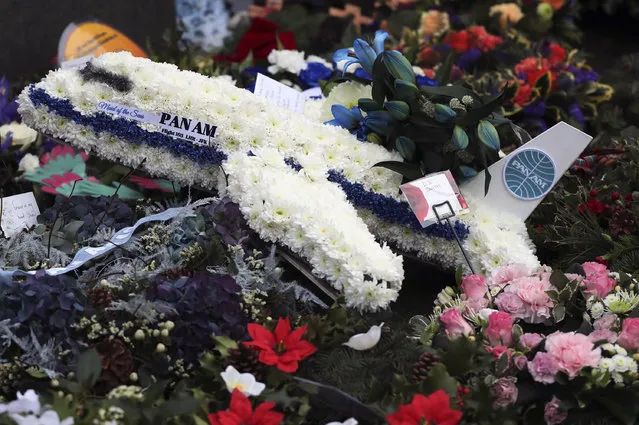 A general view of floral tributes which have been laid by the main memorial stone in memory of the victims of Pan Am flight 103 bombing, in the garden of remembrance at Dryfesdale Cemetery, near Lockerbie, Scotland. Friday December 21, 2018. Memorial services are being held in Scotland and the United States to remember the 270 people killed when a Pan Am passenger plane exploded over the town of Lockerbie 30 years ago. (Pnoto by Scott Heppell/AP Photo)