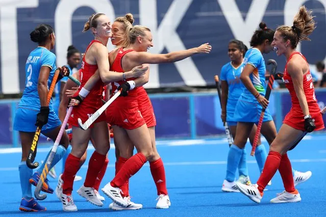 Hannah Martin of Britain celebrates with teammates after scoring a goal during the Women's Preliminary Pool A match between Great Britain and India on day five of the Tokyo 2020 Olympic Games at Oi Hockey Stadium on July 28, 2021 in Tokyo, Japan. (Photo by Bernadett Szabo/Reuters)