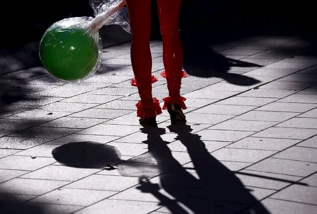 A performer dressed in costume casts a shadow as they prepare to participate in the Gay and Lesbian Mardi Gras parade in Sydney, Australia, March 5, 2016. (Photo by David Gray/Reuters)