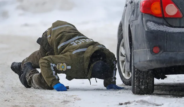 Police officers patrol the perimeter at the scene of a fatal shooting at the Quebec Islamic Cultural Centre in Quebec City, Canada January 30, 2017. (Photo by Mathieu Belanger/Reuters)