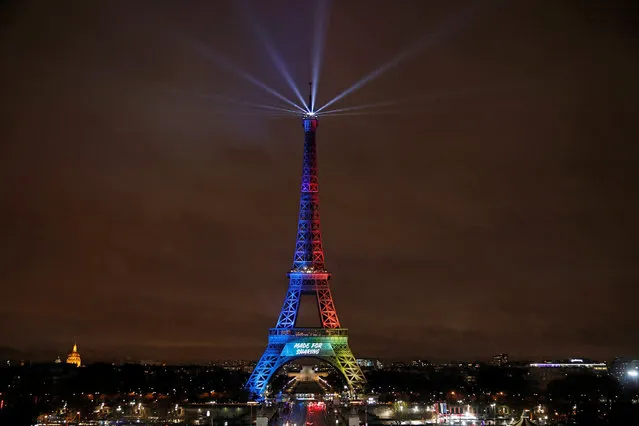 A picture shows the Eiffel Tower lit in the colours of the Olympic flag during the launch of the international campaign for the Paris bid to host the 2024 Olympic Games, in Paris, France, February 3, 2017. (Photo by Benoit Tessier/Reuters)