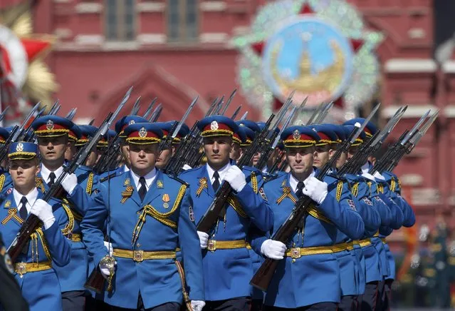 Serbian army soldiers march along the Red Square during a general rehearsal for the Victory Day military parade which will take place at Moscow's Red Square on May 9 to celebrate 70-years after the victory in WWII, in Moscow, Russia, Thursday, May 7, 2015. (Photo by Ivan Sekretarev/AP Photo)