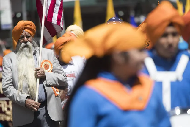 Participants march down Madison Avenue during the Sikh Day Parade, celebrating the Sikh holiday of Vaisakhi, Saturday, April 27, 2019, in New York. (Photo by Mary Altaffer/AP Photo)