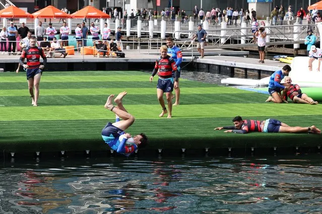 A player goes into the harbour after scoring a try in Game 2 -Mosman v Norths mens fixture during the Aqua Rugby festival on April 11, 2024 in Sydney, Australia. (Photo by Don Arnold/WireImage) (Photo by Don Arnold/WireImage)
