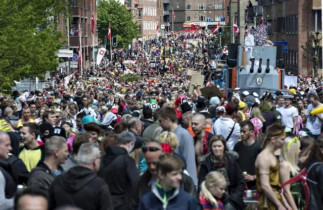 People throng the street during the Grand Parade of Aalborg Carnival in Aalborg, Denmark May 23, 2015. (Photo by Henning Bagger/Reuters/Scanpix Denmark)