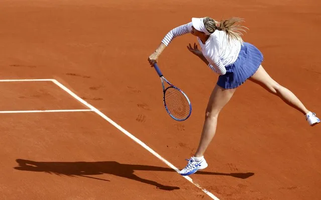 Maria Sharapova of Russia plays a shot to Kaia Kanepi of Estonia during their women's singles match at the French Open tennis tournament at the Roland Garros stadium in Paris, France, May 25, 2015. (Photo by Jean-Paul Pelissier/Reuters)