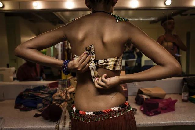 Contestants in the Miss Africa Pageant prepare themselves and their traditional outfits for the start of the pageant on April 30, 2016 in Johannesburg, South Africa. Barefoot, wearing traditional costumes including animal hide skirts and elaborately beaded headdresses, the contestants strutted the stage before Ghanaian Rebecca Asamoah was crowned the first Miss Africa Continent. (Photo by John Wessels/AFP Photo)