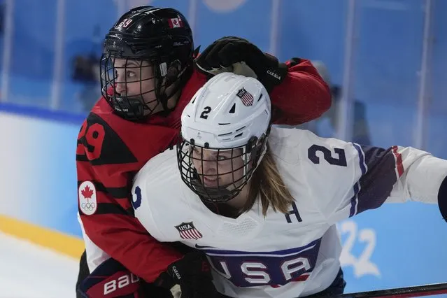 Canada's Marie-Philip Poulin collides United States' Lee Stecklein during the women's gold medal hockey game at the 2022 Winter Olympics, Thursday, February 17, 2022, in Beijing. (Photo by Petr David Josek/AP Photo)