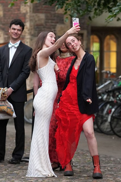 Students queue up for the Trinity May Ball at Cambridge University's Trinity College on Monday, June 17, 2024. A celebration of the end of the academic year, the first official May Ball was held in Trinity College's grounds in 1866 with the tradition quickly spreading to the other colleges. (Photo by Joe Giddens/PA Images via Getty Images)
