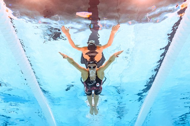 An underwater view shows Canada’s Summer McIntosh competing in the heats of women's 400m individual medley swimming event during the Paris 2024 Olympic Games at the Paris La Defense Arena in Nanterre, west of Paris, on July 29, 2024. (Photo by Manan Vatsyayana/AFP Photo)