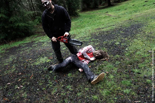 Participants learn how to survive in the wild, including tips on how to make it through a zombie invastion at a Zombie First Responder course in Sandy, Oregon