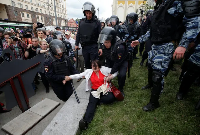 Riot police detain activist Yulia Galyamina during an anti-corruption protest organised by opposition leader Alexei Navalny, on Tverskaya Street in central Moscow, Russia on Monday, June 12, 2017. (Photo by Maxim Shemetov/Reuters)