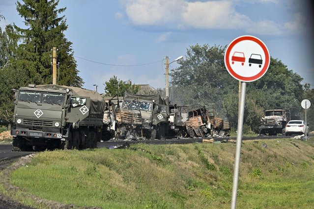 A view of the column of Russian Army trucks damaged by shelling by he Ukrainian Armed Forces on the highway in the Sudzhansky district, Kursk region of Russia, Friday, August 9, 2024. (Photo by Anatoliy Zhdanov/Kommersant Publishing House via AP Photo)