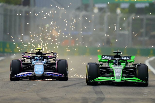 Alpine driver Pierre Gasly of France, left, and Kick Sauber driver Valtteri Bottas of Finland during the first practice session of the Singapore Formula One Grand Prix at the Marina Bay Street Circuit, in Singapore, Friday, September 20, 2024. (Photo by Vincent Thian/AP Photo)