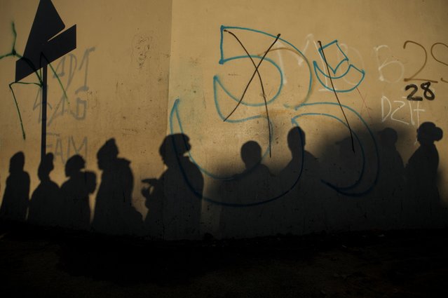 People queue to vote in the South African elections in Masiphumelele, South Africa on May 29, 2024. (Photo by Nic Bothma/Reuters)