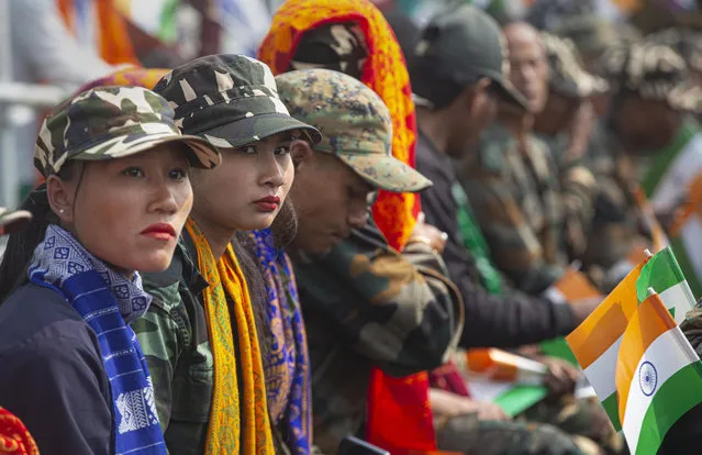 National Democratic Front of Bodoland (NDFB) cadres participate in an event to celebrate the signing of a peace accord in Kokrajhar, a town 250 kilometers (150 miles) west of Gauhati, India, Friday, February 7, 2020. Modi said on Friday that his government will continue its peace push in insurgency-wracked northeast bordering China and Myanmar where signing of accords with key rebel groups led to surrender by thousands of fighters. The prime minister said decades of violent insurrection ended in the Bodo tribal heartland in Assam state following the signing of the Jan. 27 agreement by the government with the rebel group. (Photo by Anupam Nath/AP Photo)