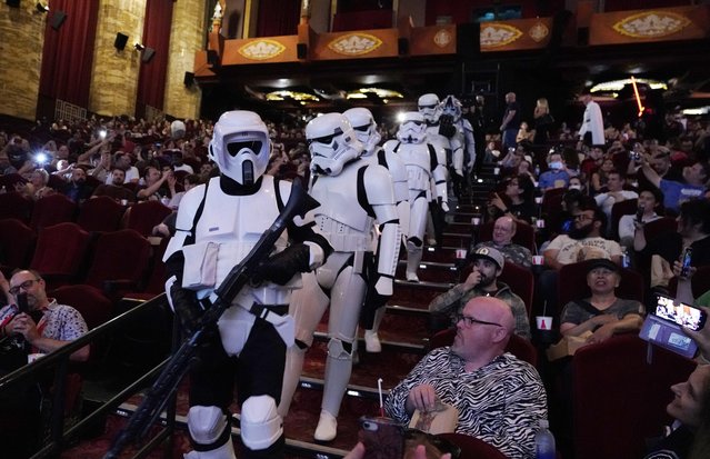 “Star Wars” stormtrooper characters march down the center aisle at the TCL Chinese Theatre before a special screening of “Star Wars: Episode V – The Empire Strikes Back”, Wednesday, August 30, 2023, in Los Angeles. The screening raised funds for the Will Rogers Motion Picture Pioneers Foundation. (Photo by Chris Pizzello/AP Photo)