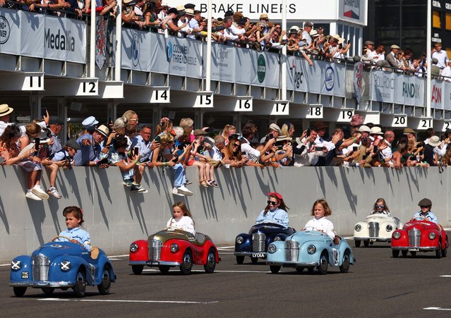 Children take part in the Settrington Cup Pedal Car Race as motoring enthusiasts attend the Goodwood Revival, a three-day historic car racing festival in Goodwood, near Chichester, southern Britain on September 9, 2023. (Photo by Toby Melville/Reuters)