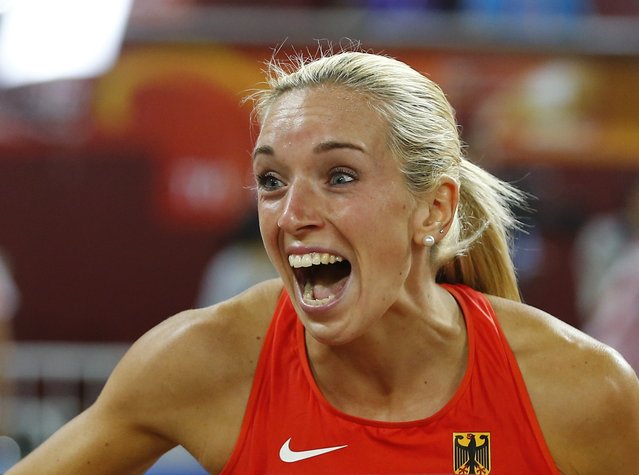 Cindy Roleder of Germany celebrates after winning silver in the women's 100 metres hurdles final during the 15th IAAF World Championships at the National Stadium in Beijing, China August 28, 2015. (Photo by Kai Pfaffenbach/Reuters)