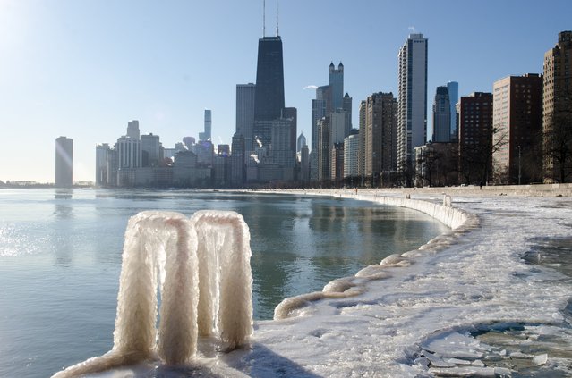 The Chicago skyline is reflected in a frozen lake, showcasing the city's winter beauty as winter weather brings outdoor recreational activities on January 8, 2025. (Photo by Jacek Boczarski/Anadolu via Getty Images)