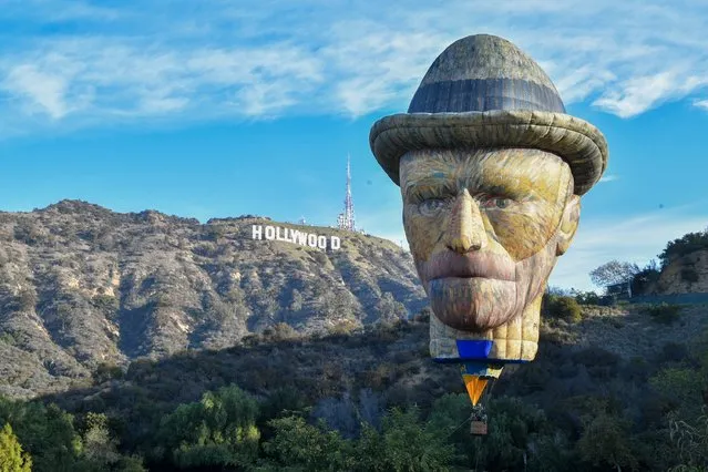 Lighthouse Immersive's 92-foot-tall Vincent Van Gogh-shaped hot air balloon is launched at Lake Hollywood Park on December 20, 2021 in Los Angeles, California. (Photo by Rodin Eckenroth/Getty Images)